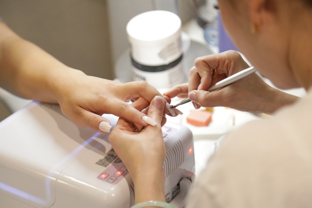 Person getting their nails done at a salon